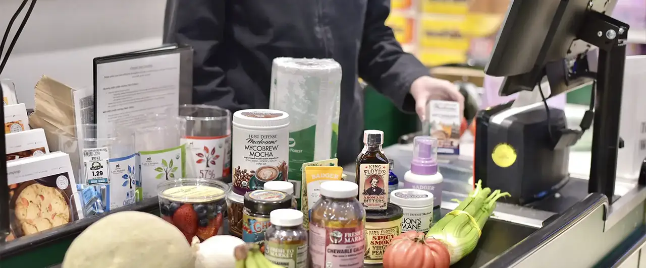 Natural health and beauty products on a store shelf.